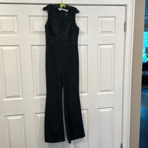 Adrianna Papell sequenced and modestly fringed black jumpsuit size 8.